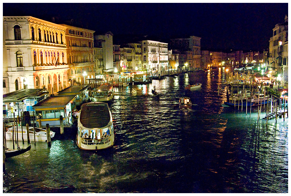View of the Grand Canal from the Rialto bridge at night.