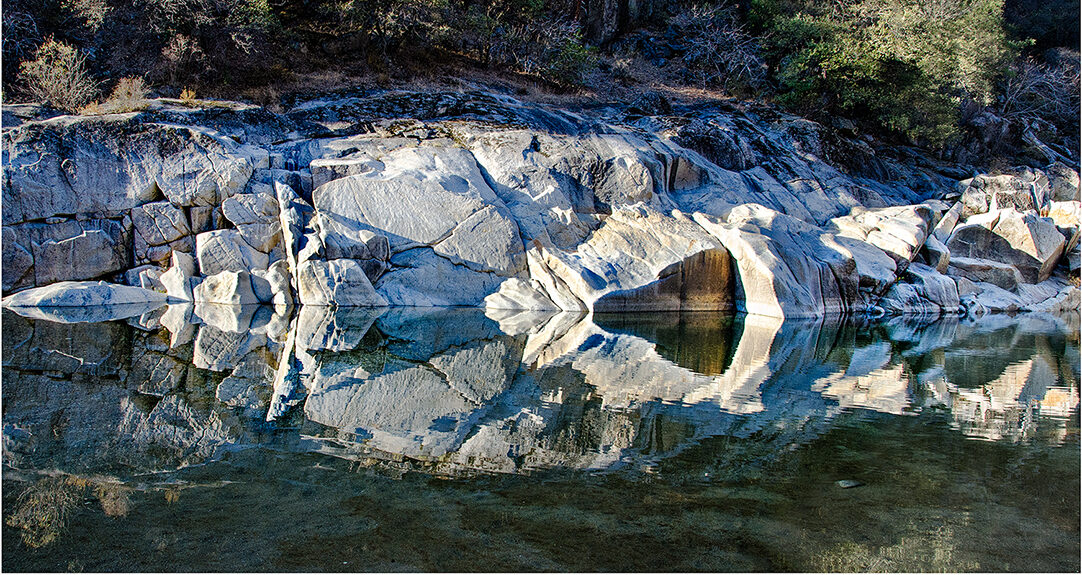 Reflections of river rocks on the Yuba River