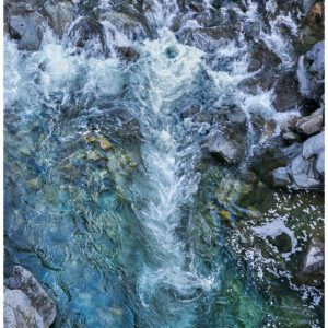 Swirling water forms fleeting images in the Yuba River